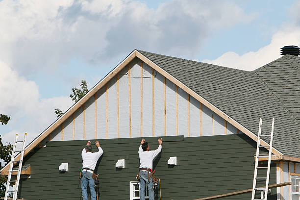 Professional Siding Installation technician working in Beach City, OH